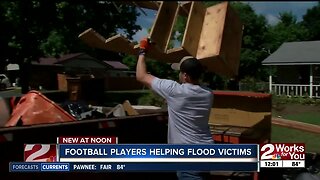 Charles Page High School's football team helps flood victims