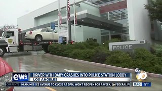 Driver with baby crashes into police station lobby.