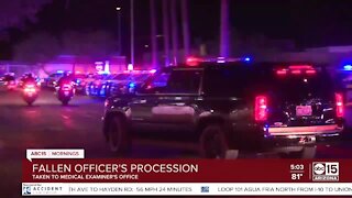 Officers escort body of officer killed in crash to medical examiner