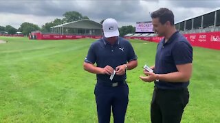 Bryson DeChambeau opens Upper Deck Artifacts golf cards with WXYZ's Brad Galli