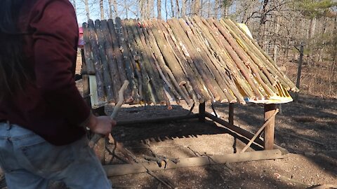 Covering the feed bags with sticks & branches