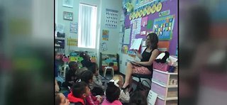 GMLV anchor Beth Fisher reads to students