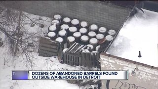Fire marshal investigating unidentified barrels found behind building in northeast Detroit