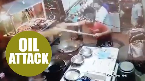 Moment a street vendor allegedly hit back at complaining customers - by throwing HOT OIL at them