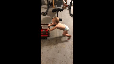 Baby trains for strongman competition