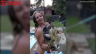 Woman Holds Snapping Turtle