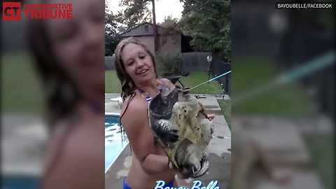 Woman Holds Snapping Turtle