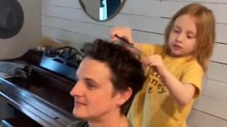 Dad lets daughter cut his hair