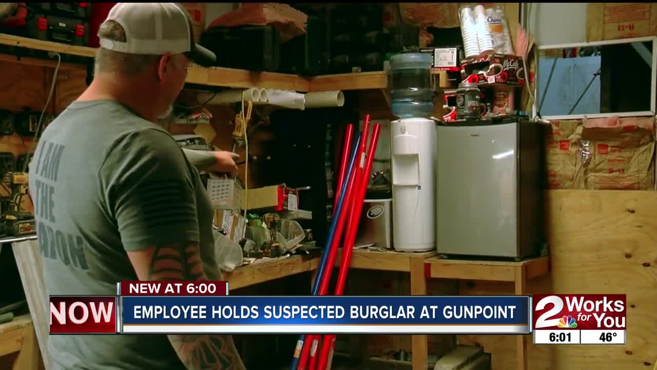 Employee holds suspected burglar at gunpoint