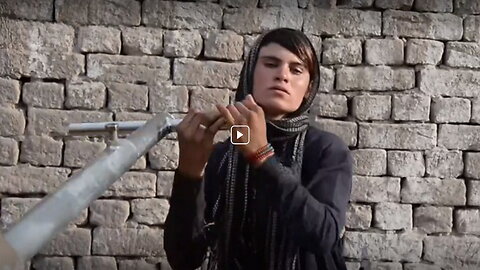 An Afghan woman forced to dress as a man