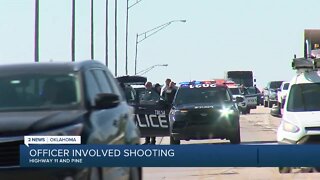 Tulsa police officer fires at armed man on highway