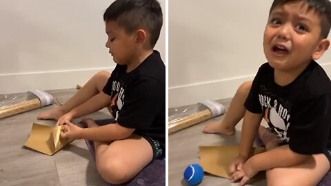 Kid Hilariously Fails to Wrap Present for His Puppy