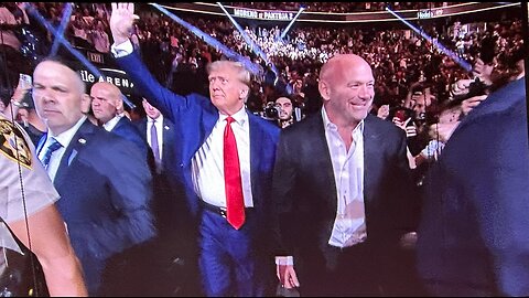 President Trump receives wild cheers from MMA fans as he walks UFC 290 arena in Las Vegas