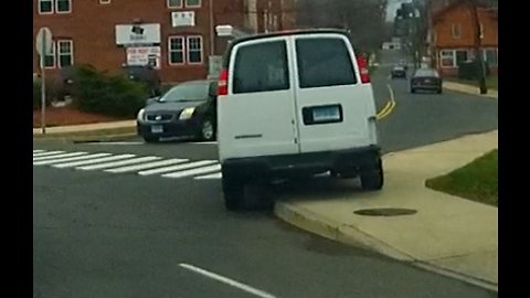 White van loses cap and a curb jumper