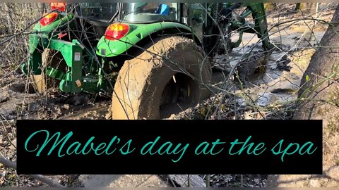 Mabel's mud treatment-our John Deere tractor tries her hand at swimming in our creek #debtfree