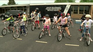South Milwaukee police officers teach third graders how to ride bikes safely