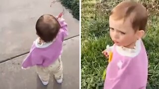 Sweet little girl loves to wave at construction workers