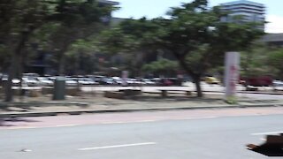 South Africa - Cape Town_ People struggling with wind in Civic Centre (Video) (38N)