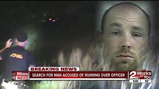 Manhunt underway for man accused of running over police officer