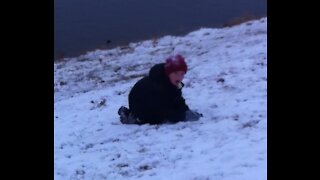 Carson throwing a Snowball Into a Lake