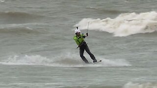 Surfers brave frigid water to catch some waves in Cleveland