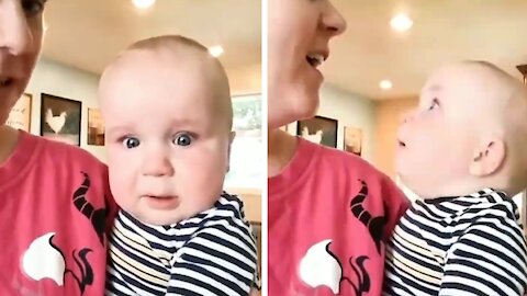 Baby gets scared and cries with his mother's singing