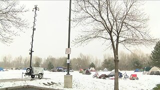 Fort Collins temporary indoor shelter sees homeless people create a tent city across the way