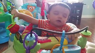 Multitasking Baby Bounces Himself To Sleep