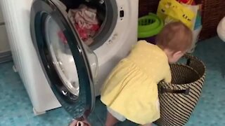 Baby Adorably Helps Her Mom With The Laundry