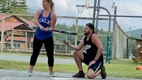 Guy Proposes to Girlfriend During Baseball Match and Nearly Gets Hit by Bat