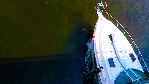 Yachts cruise under Flora Footbridge - Ottawa, Canada