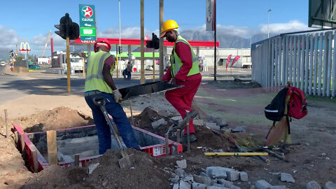 Stock: Construction workers install Telkom infrastructure