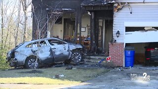 Fire erupts after SUV crashes into home in Middle River