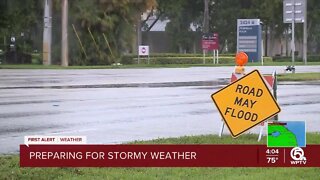 Signs warn drivers of flooding in Boca Raton