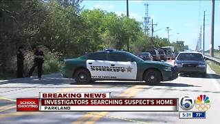 Investigators searching suspect's home