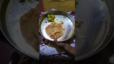 Eating Poori with potatoe masala. 😊