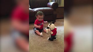 Funny Baby Boy Dances With His Dancing Toy