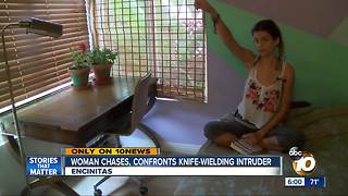 Woman confronts knife-wielding intruder