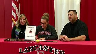 Laura Zimmerman signs scholarship