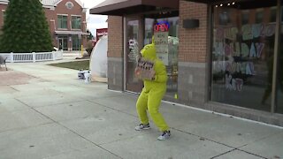 Metro Detroit business owner dresses up as Grinch to spread holiday cheer