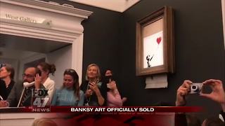 Banksy artwork self-destructs moment after $1.4M sale