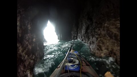 Kayaking through the caves of the Arch Rock