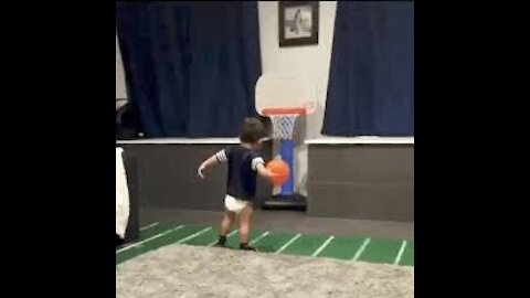 Cute babies playing basketball