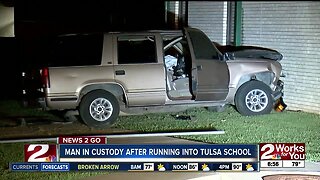 Man in custody after crashing into Tulsa school