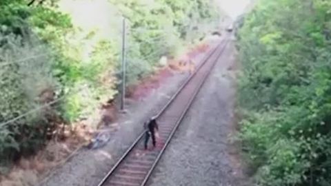Heroic rail worker saves cyclist from oncoming train
