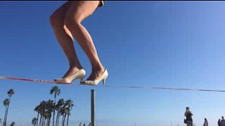 American athlete slacklines in high heels!