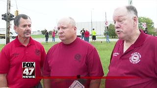 Union members walking the picket line at GM plant in Delta Township