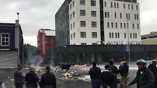 Students allegedly carried a pool table and rubbish into Main Road