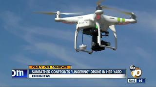 Sunbather confronts drone in her yard