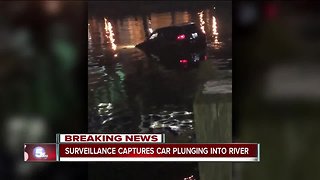 Surveillance video captures car plunging into river